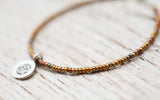 Silver Om bracelet with bronze