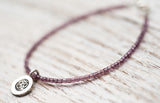 Silver Om bracelet with light purple
