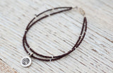 Silver Om bracelet with double chocolate