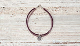 Silver Om bracelet with double purple