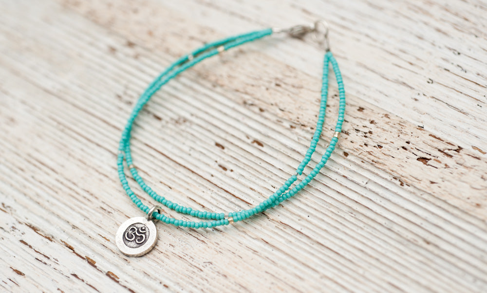 Silver Om bracelet with double turquoise
