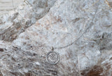 Small Om necklace on delicate silver wire