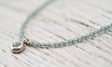 Silver Om necklace with montana blue