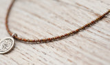 Small Om necklace with bronze