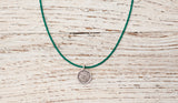 Small Om necklace with emerald green