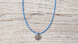 Small Om necklace with sky blue