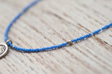 Small Om necklace with sky blue
