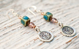 Om earrings with porcelain and rose glass