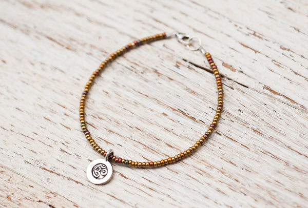 Silver Om bracelet with bronze