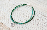 Silver Om bracelet with double green