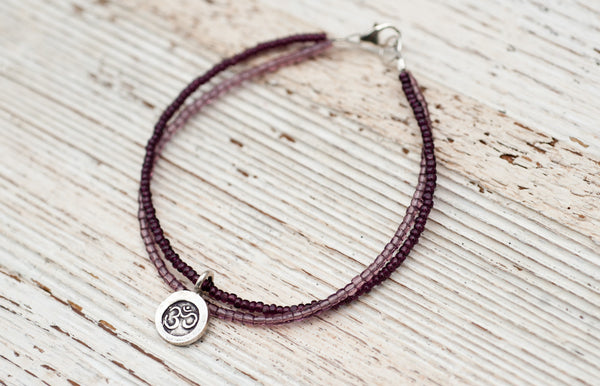 Silver Om bracelet with double purple