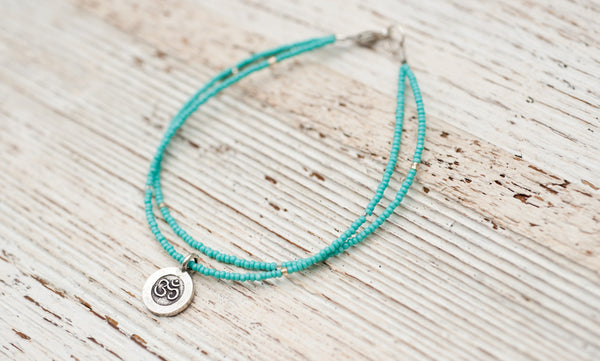 Silver Om bracelet with double turquoise