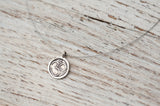 Small Om necklace on delicate silver wire