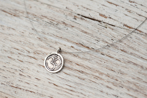Small Om necklace on delicate silver wire