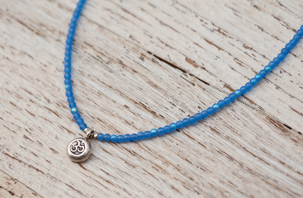 Silver Om necklace with irridescent blue