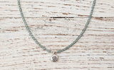 Silver Om necklace with montana blue