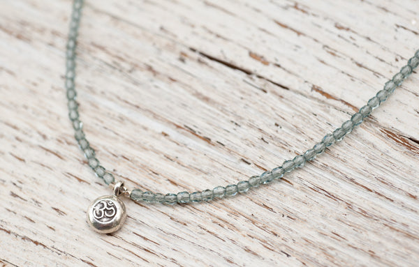 Silver Om necklace with montana blue