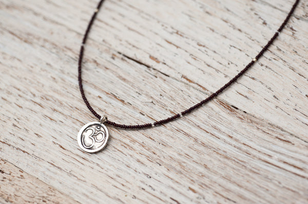 Small Om necklace with chocolate