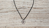 Small Om necklace on black cord