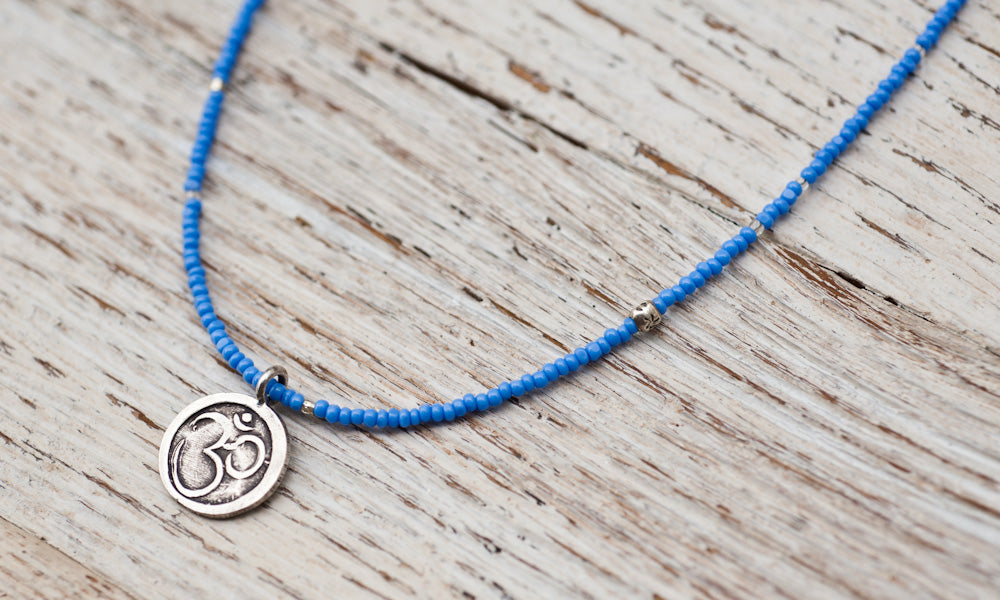 Small Om necklace with sky blue